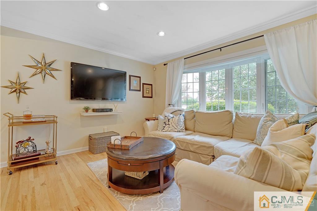 26 Mercer Road Old Bridge, NJ 08857 - Photo 4 of 23 a living room with furniture and a flat screen tv
