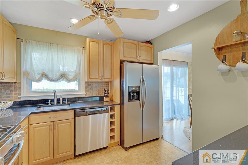 26 Mercer Road Old Bridge, NJ 08857 - Photo 9 of 23 a kitchen with stainless steel appliances a refrigerator sink and cabinets