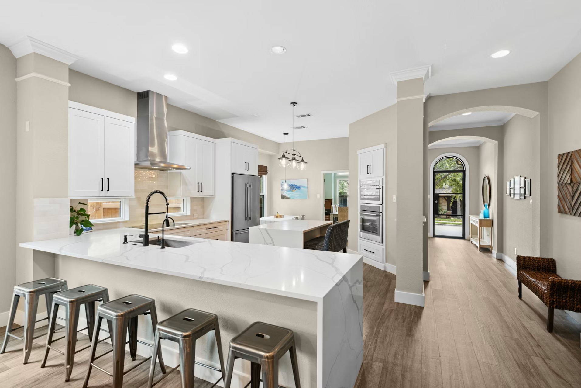 320 El Socorro Lane Austin, TX 78732 - Photo 29 of 40 a living room with stainless steel appliances kitchen island granite countertop furniture and wooden floor