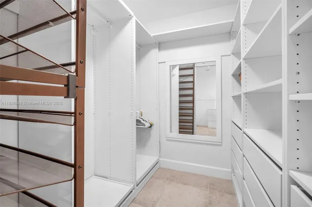 a view of a hallway with a window