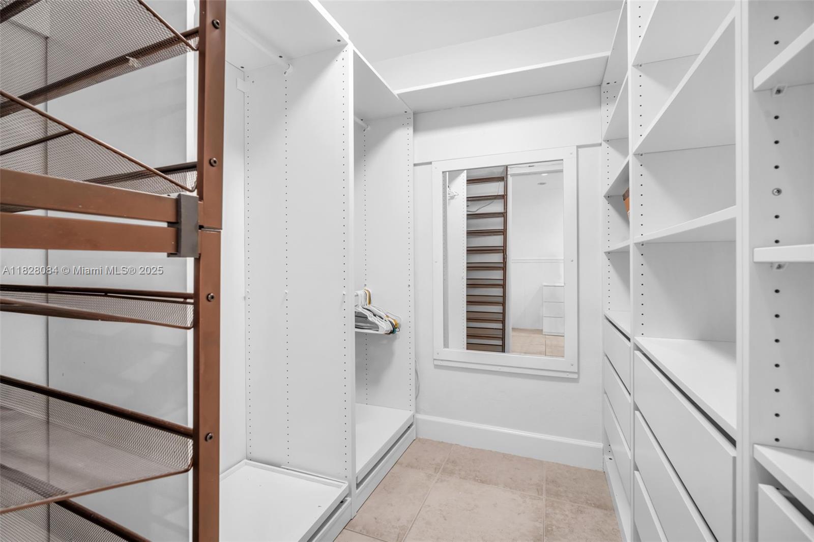 611 Ocean Drive, Unit 3E Key Biscayne, FL 33149 - Photo 14 of 30 a view of a hallway with a window