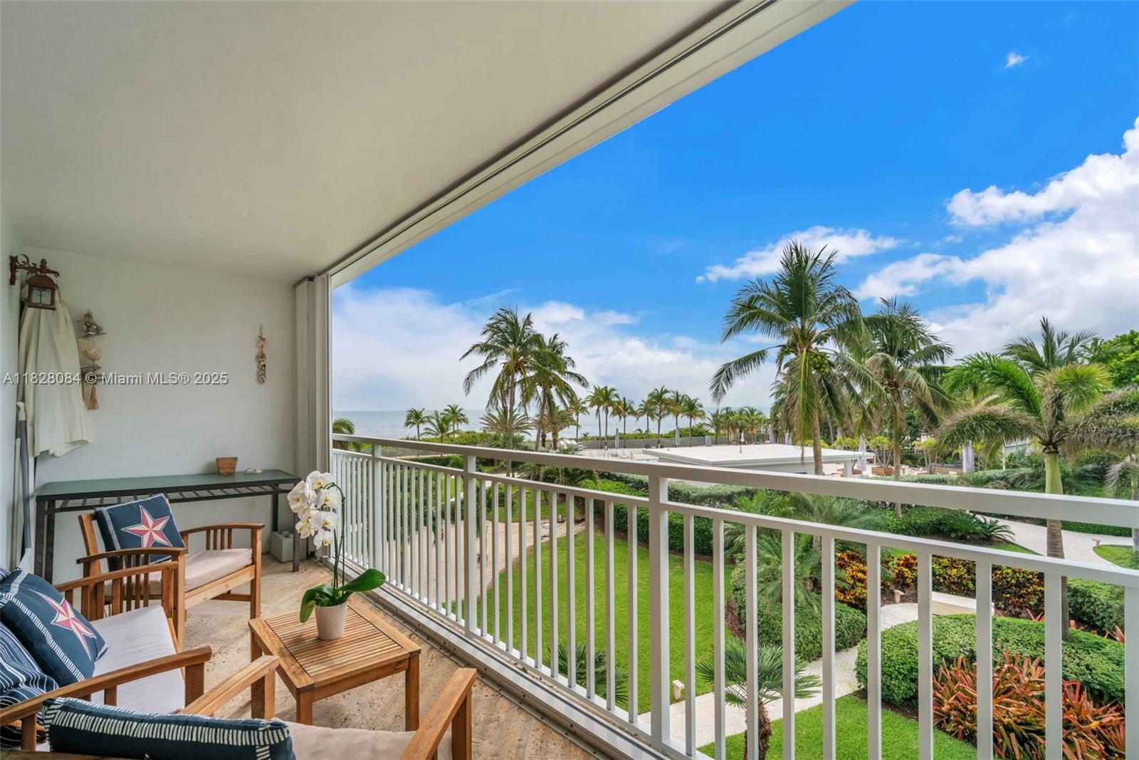 611 Ocean Drive, Unit 3E Key Biscayne, FL 33149 - Photo 18 of 30 a view of a balcony with chairs