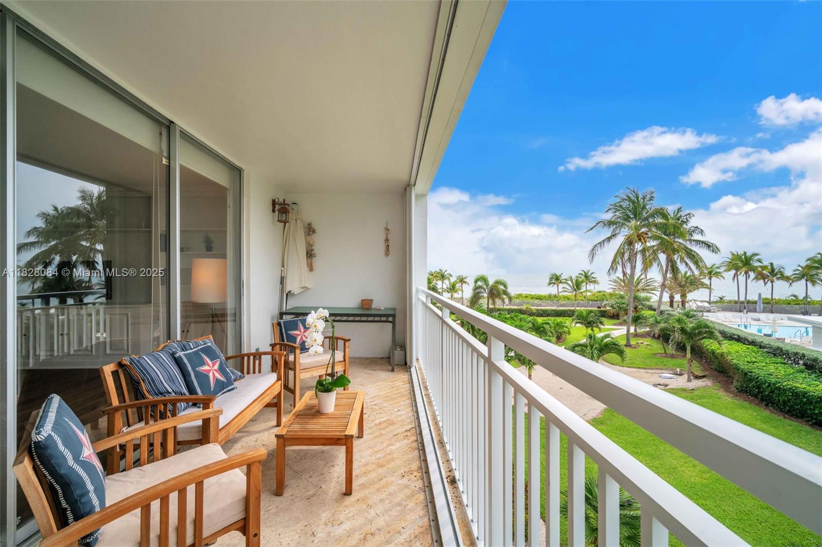 611 Ocean Drive, Unit 3E Key Biscayne, FL 33149 - Photo 19 of 30 a balcony with furniture and city view