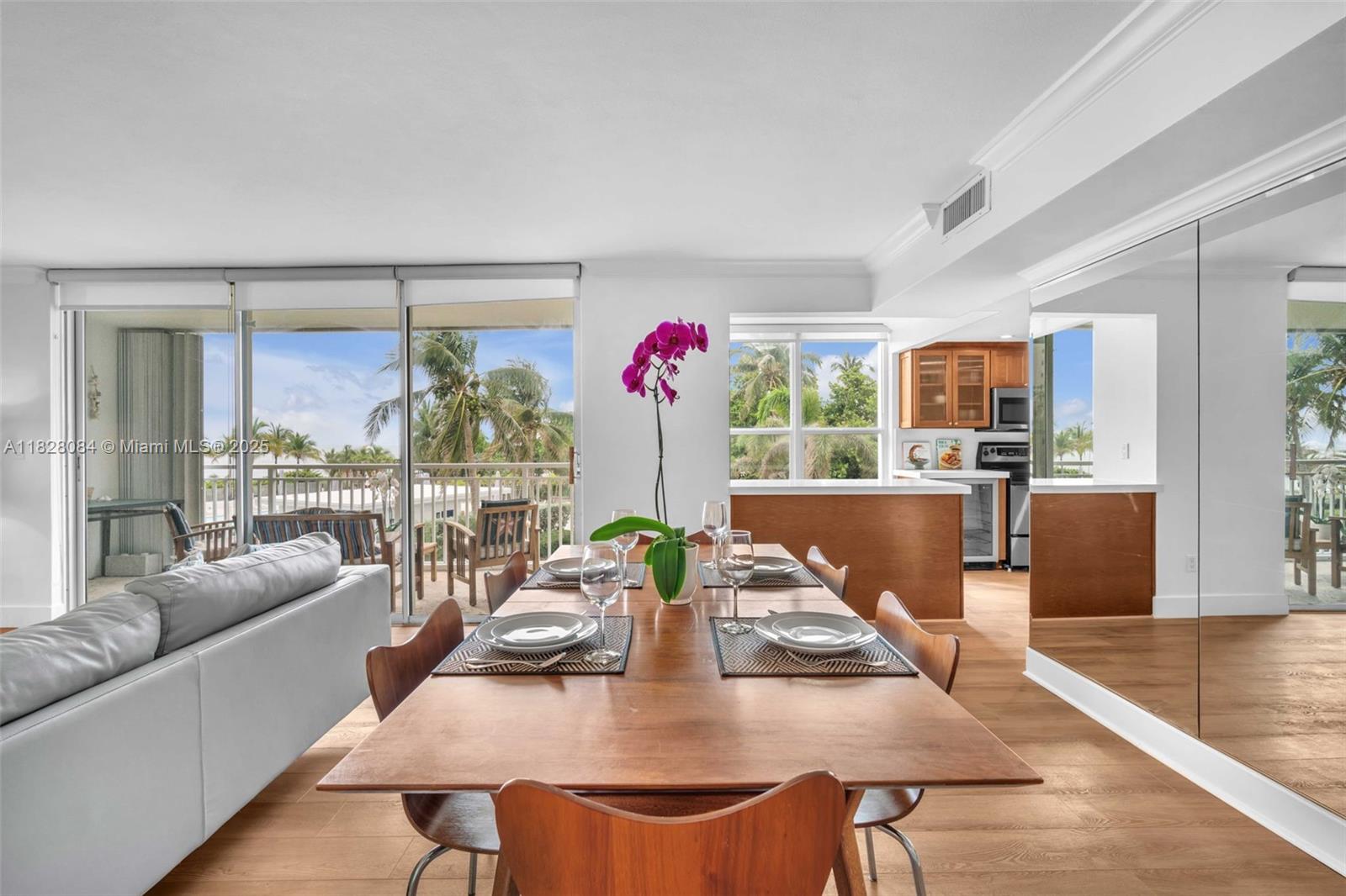 611 Ocean Drive, Unit 3E Key Biscayne, FL 33149 - Photo 2 of 30 a view of a dining room with furniture window and outside view