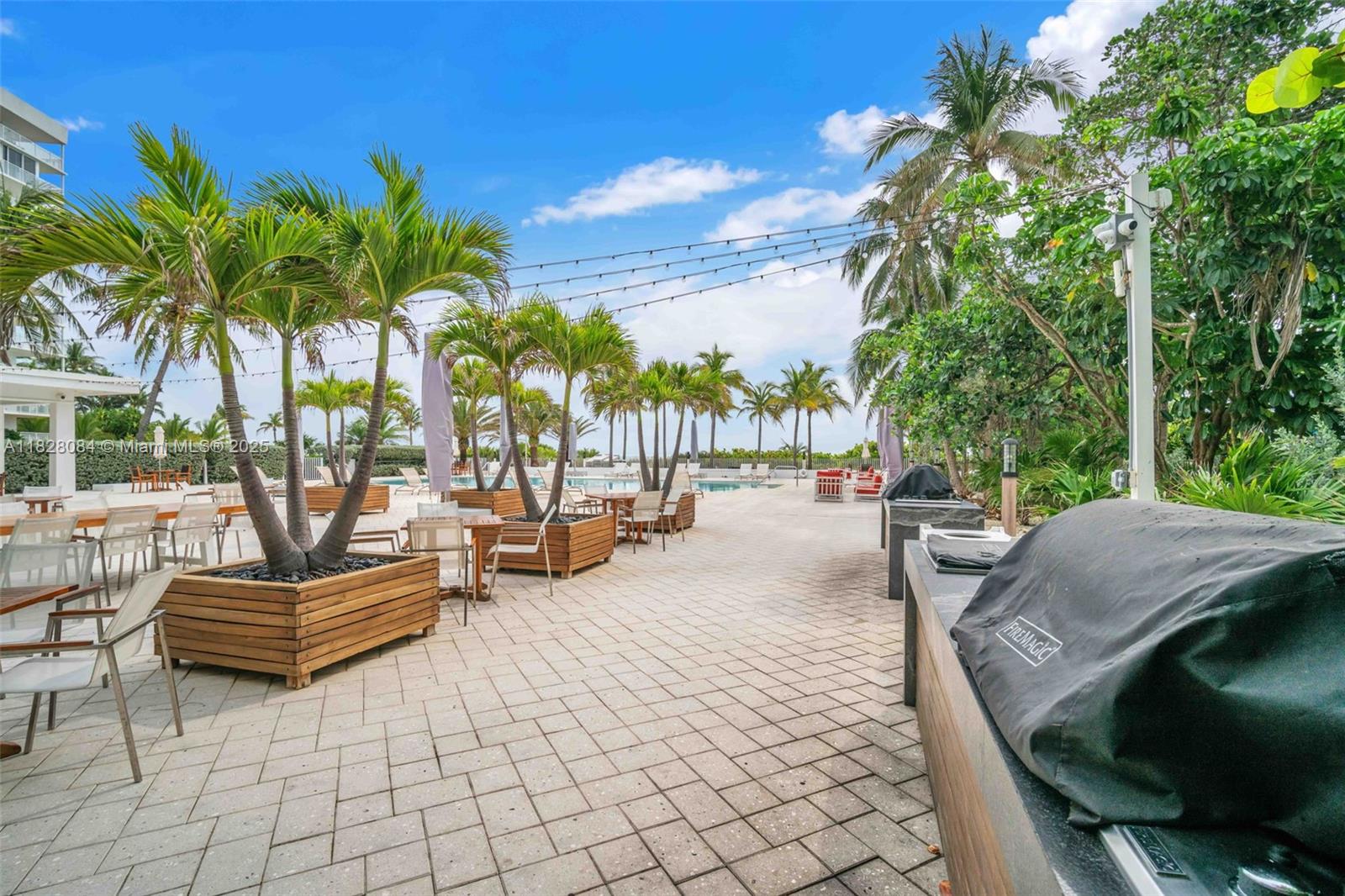 611 Ocean Drive, Unit 3E Key Biscayne, FL 33149 - Photo 22 of 30 a view of outdoor space yard deck patio and swimming pool