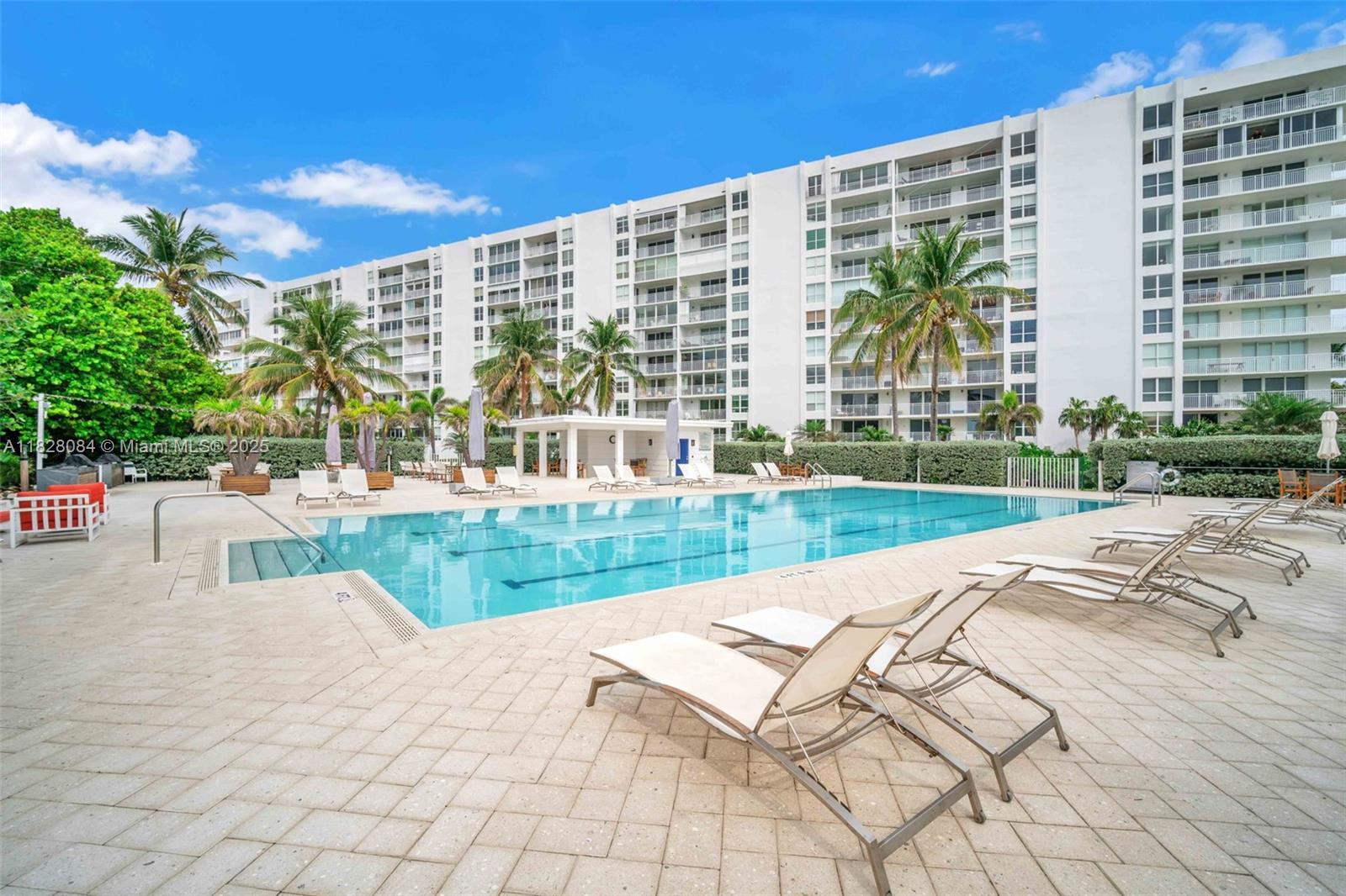 611 Ocean Drive, Unit 3E Key Biscayne, FL 33149 - Photo 24 of 30 a view of swimming pool with a garden