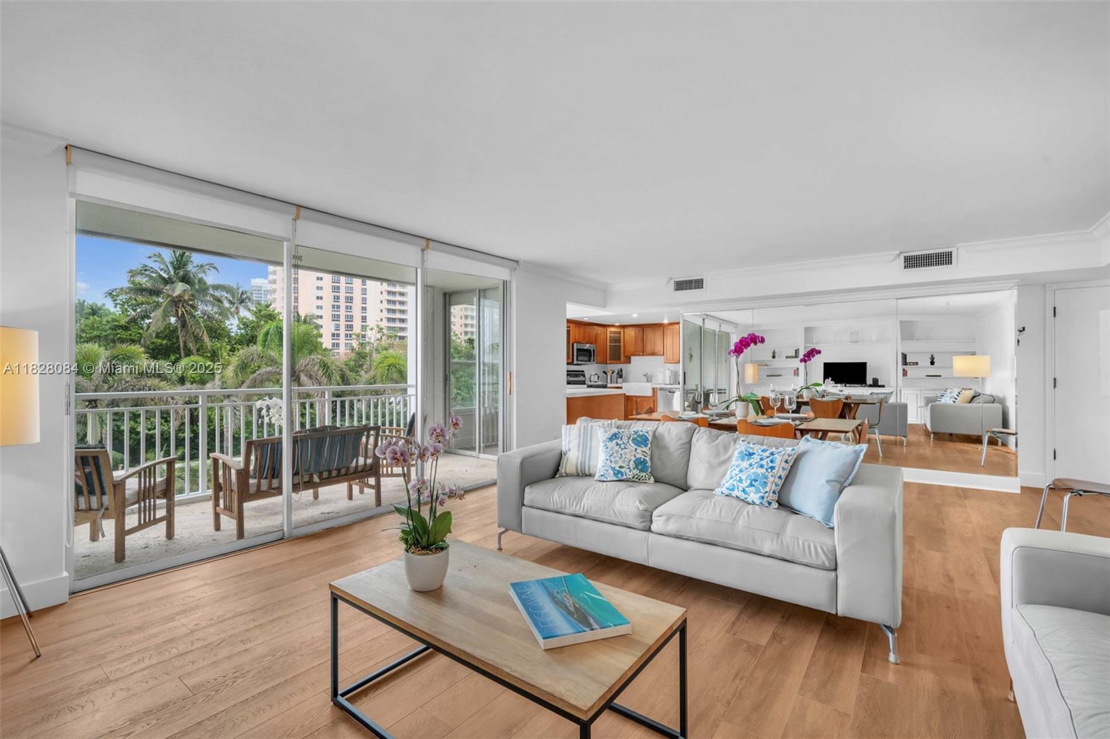 611 Ocean Drive, Unit 3E Key Biscayne, FL 33149 - Photo 3 of 30 a living room with furniture and a large window