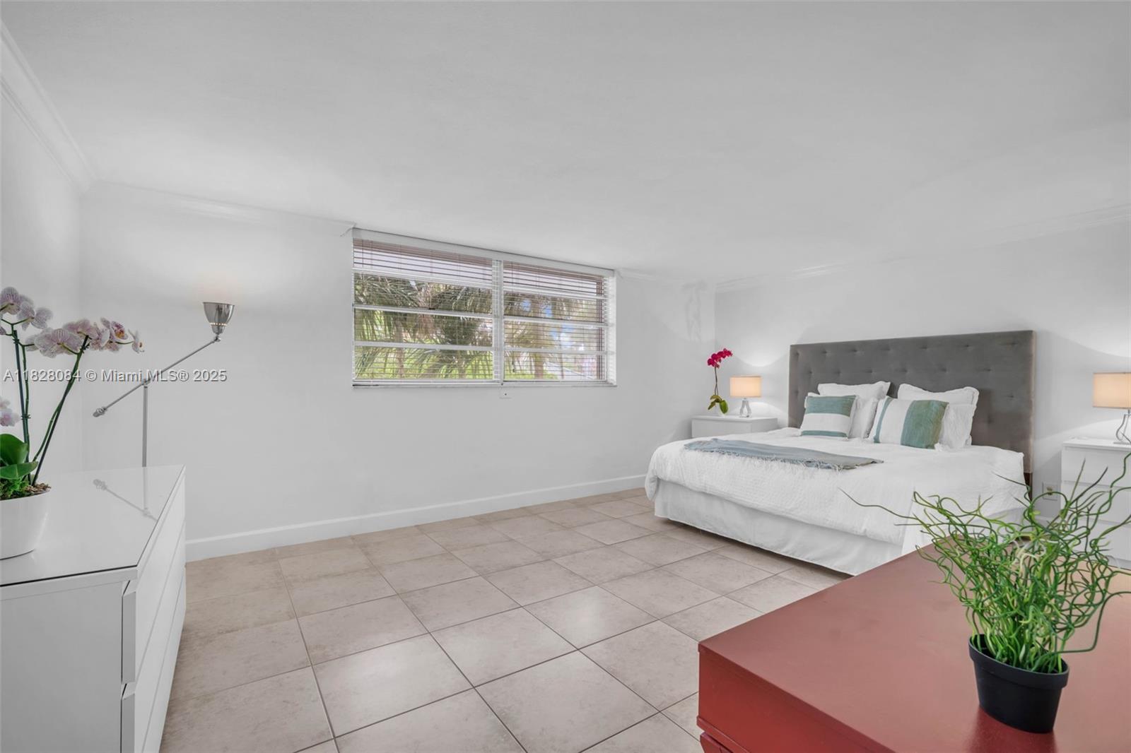 611 Ocean Drive, Unit 3E Key Biscayne, FL 33149 - Photo 10 of 30 a bedroom with bed and window