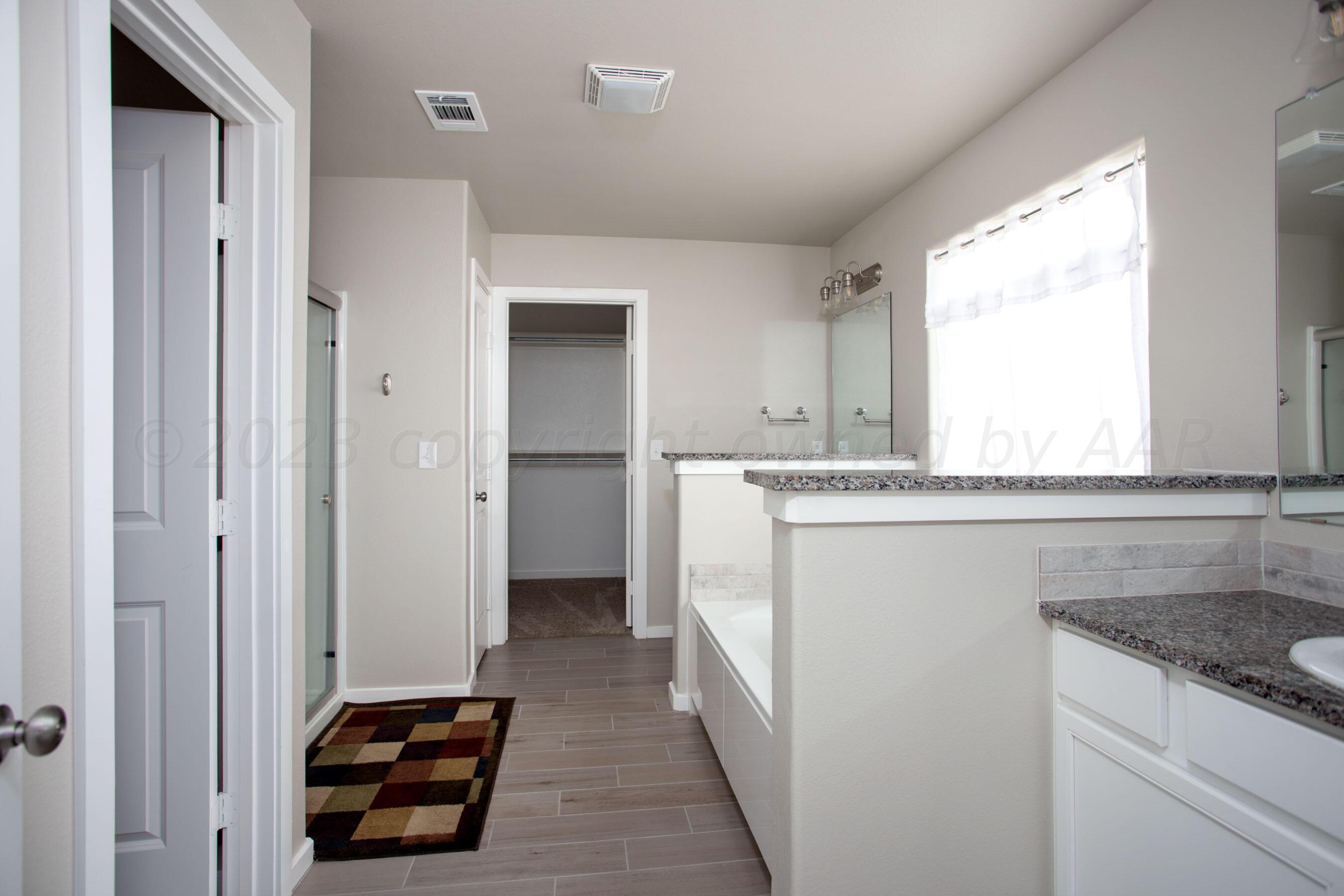 7811 Bellamy Drive Amarillo, TX 79119 - Photo 11 of 24 a kitchen with a refrigerator and a sink