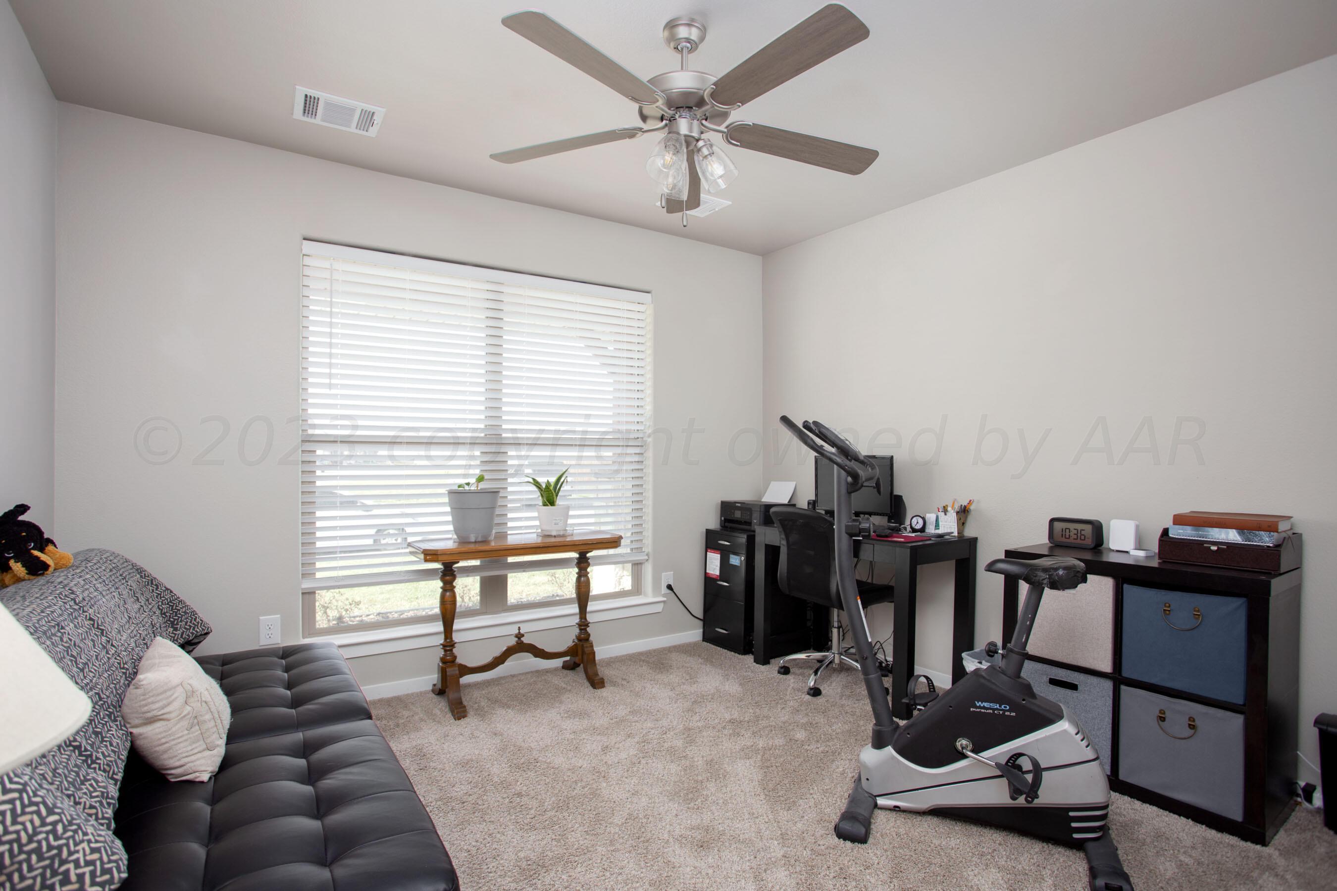 7811 Bellamy Drive Amarillo, TX 79119 - Photo 15 of 24 a view of a workspace with furniture and windows