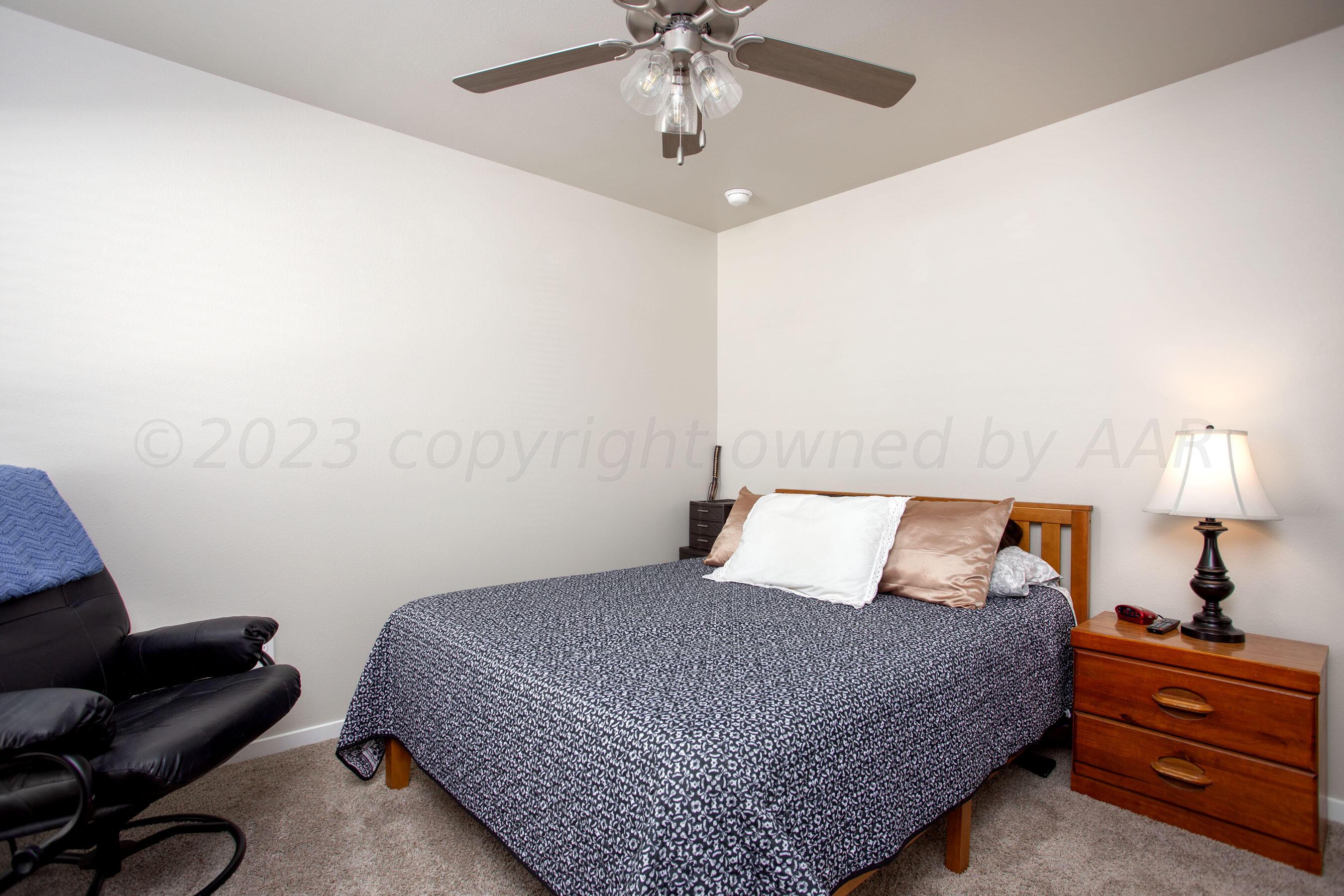 7811 Bellamy Drive Amarillo, TX 79119 - Photo 17 of 24 a bedroom with a bed and window