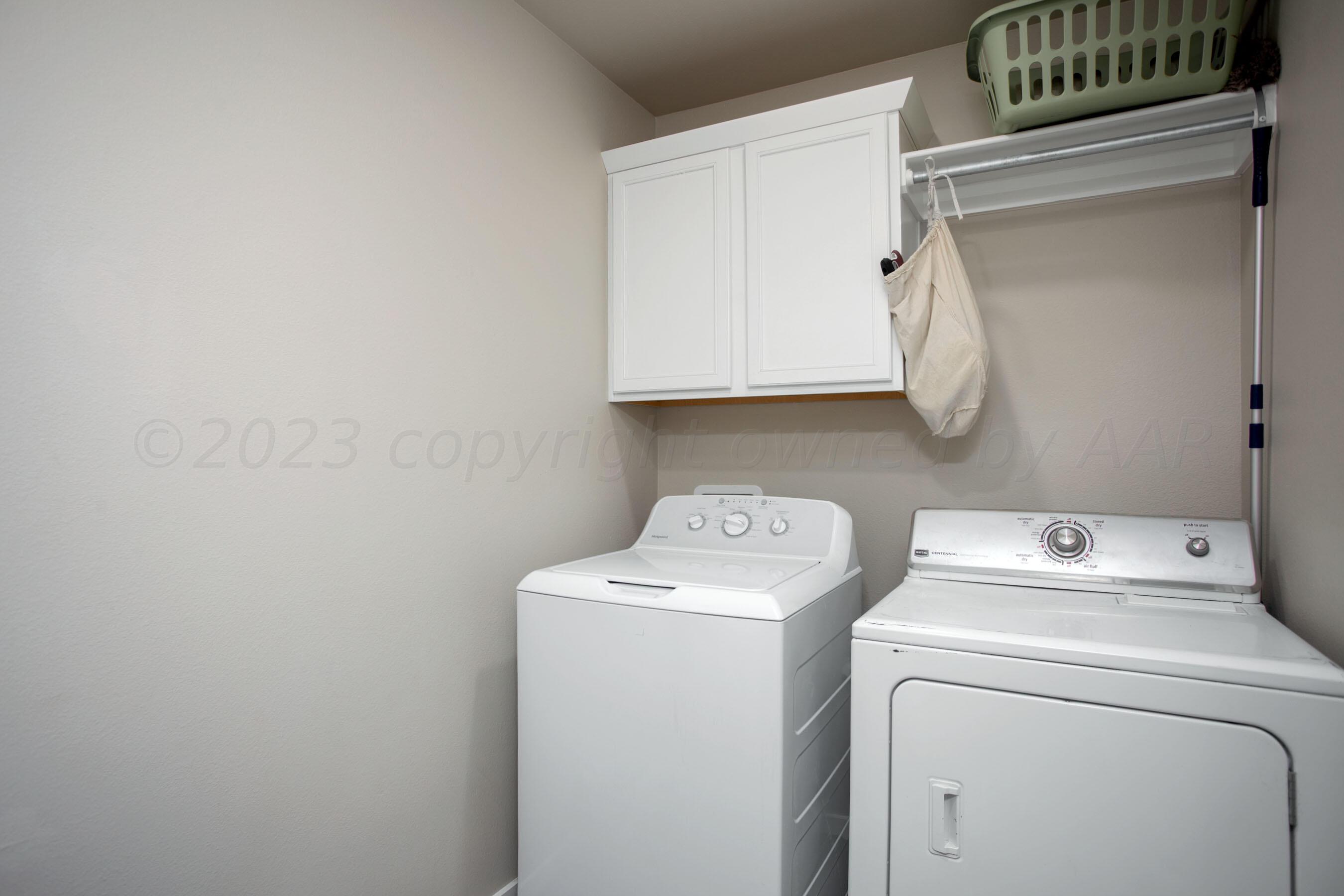 7811 Bellamy Drive Amarillo, TX 79119 - Photo 20 of 24 a utility room with dryer and washer