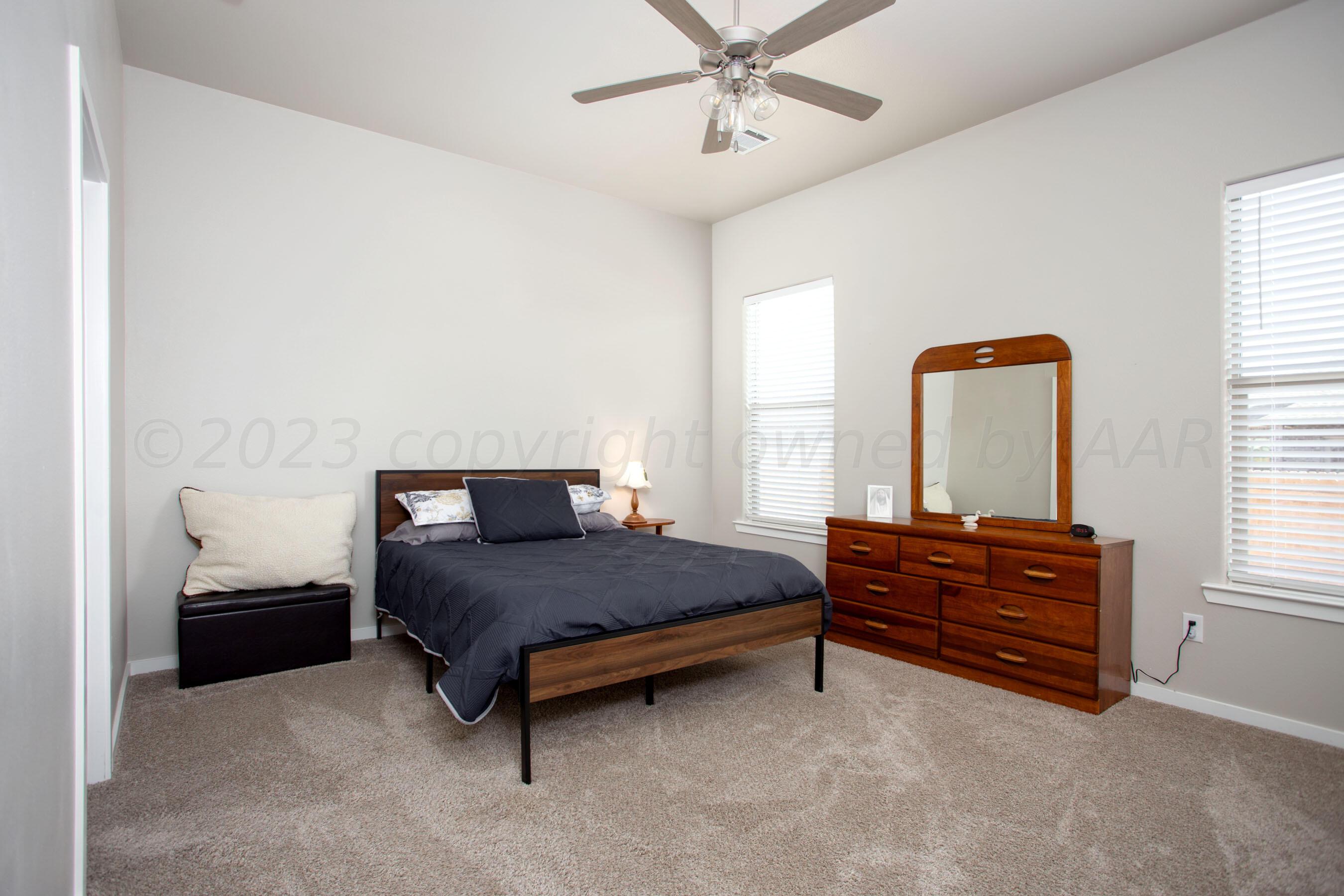 7811 Bellamy Drive Amarillo, TX 79119 - Photo 9 of 24 a bedroom with a bed and window