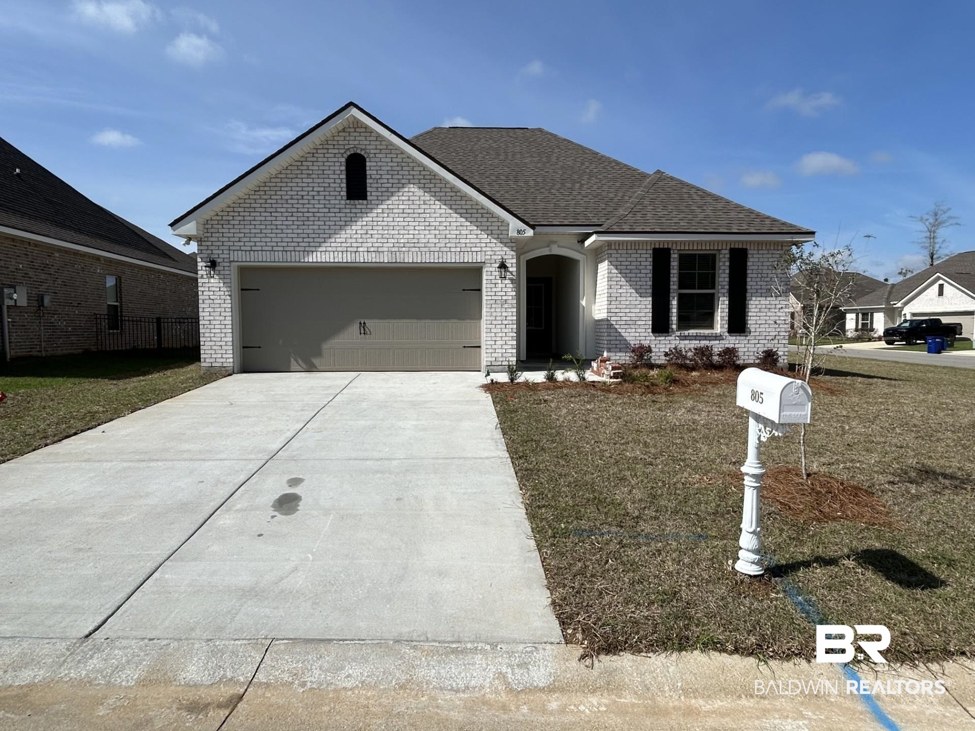 805 Sumter Loop Foley, AL 36535 - Photo 1 of 3 View of front of home with brick siding, a garage, concrete driveway, and a front yard