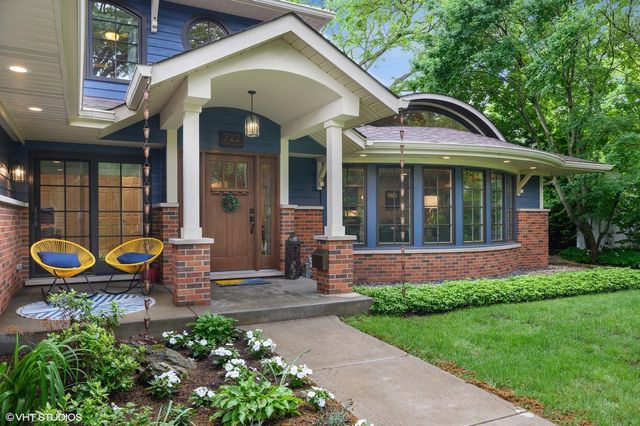 a front view of a house with a garden and patio