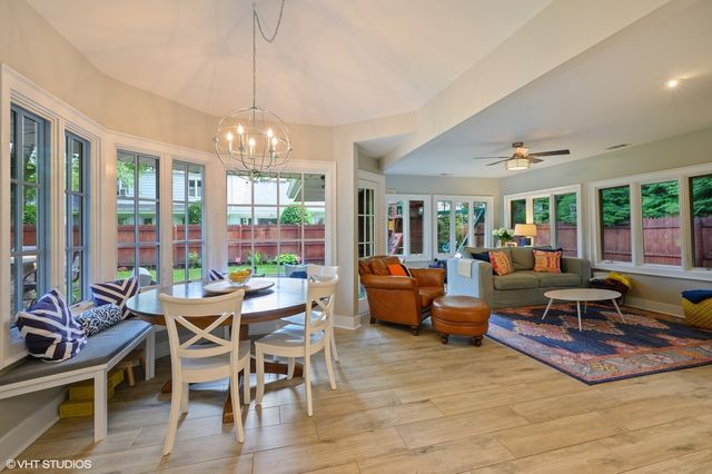 a living room with furniture fireplace and flat screen tv