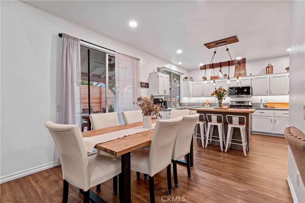 28630 Oak Valley Road Castaic, CA 91384 - Photo 13 of 54 a view of a dining room with furniture and wooden floor