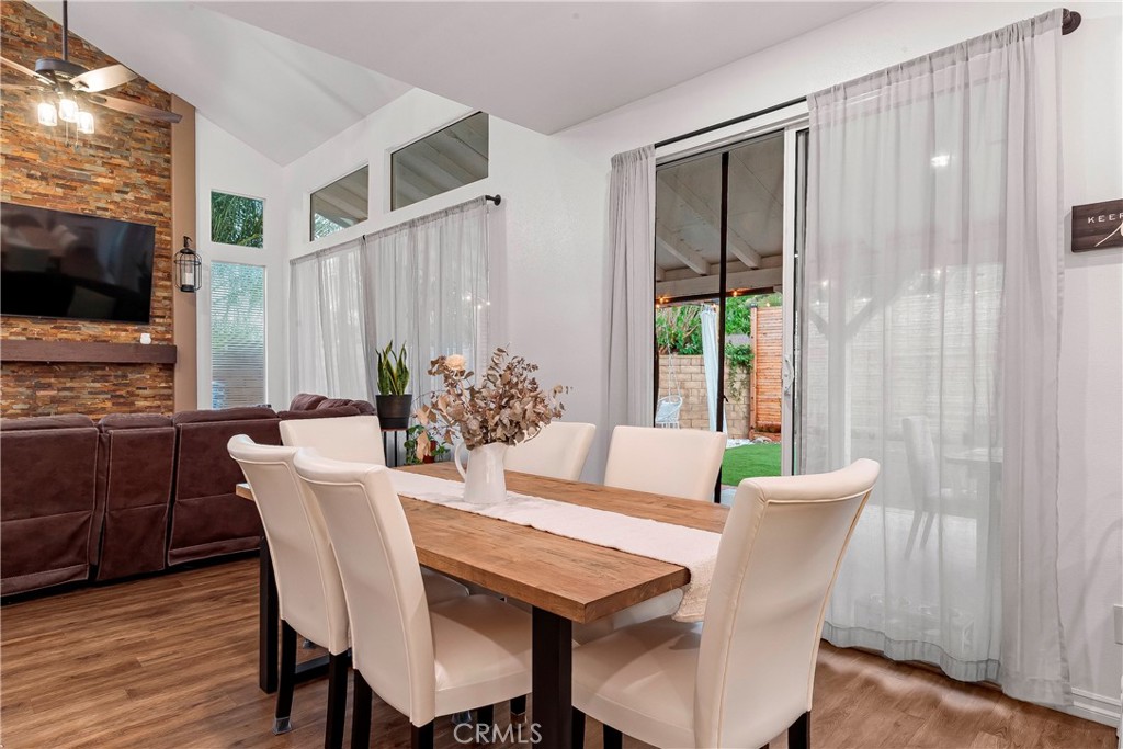 28630 Oak Valley Road Castaic, CA 91384 - Photo 14 of 54 a view of a dining room with furniture window and wooden floor