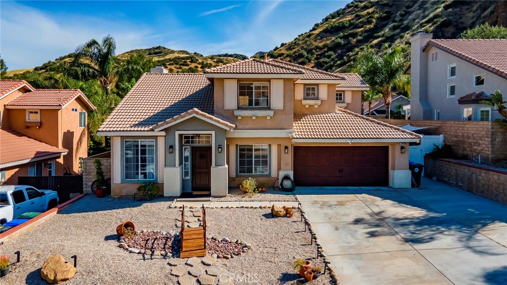 28630 Oak Valley Road Castaic, CA 91384 - Photo 2 of 54 a front view of a house with yard