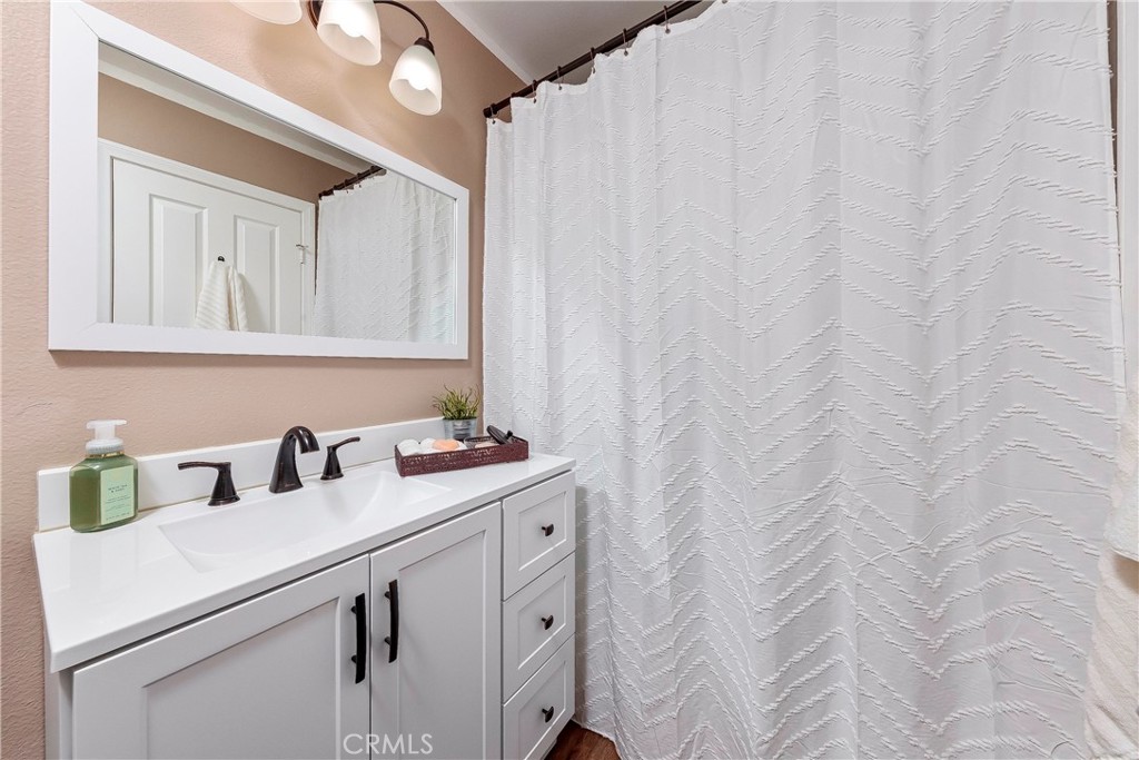 28630 Oak Valley Road Castaic, CA 91384 - Photo 21 of 54 a bathroom with a sink and a mirror