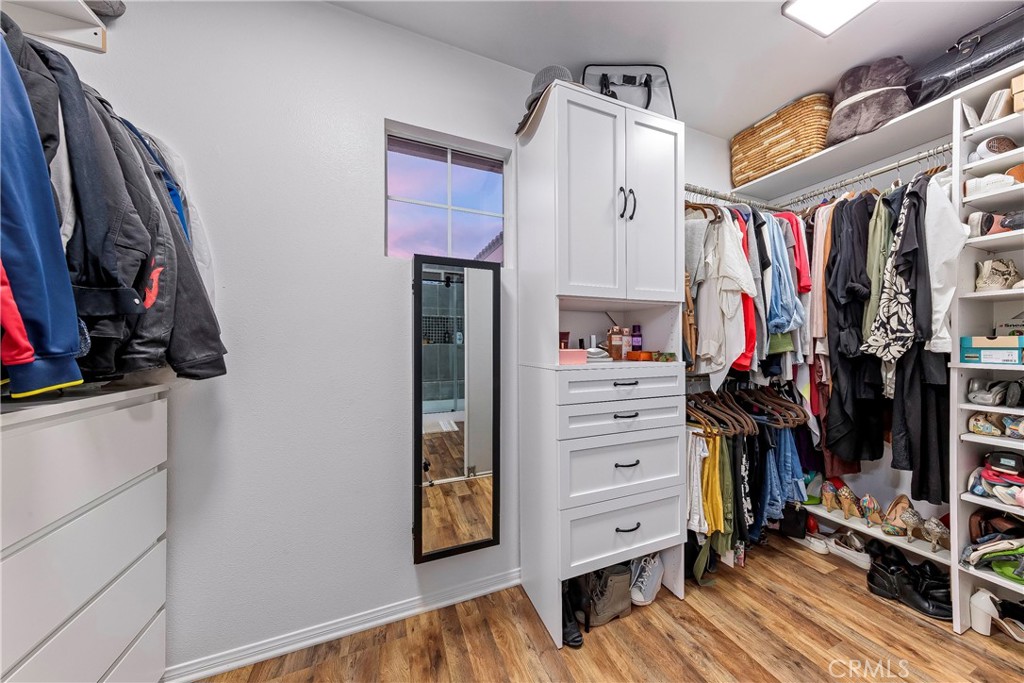 28630 Oak Valley Road Castaic, CA 91384 - Photo 27 of 54 a view of walk in closet with clothes and shoes