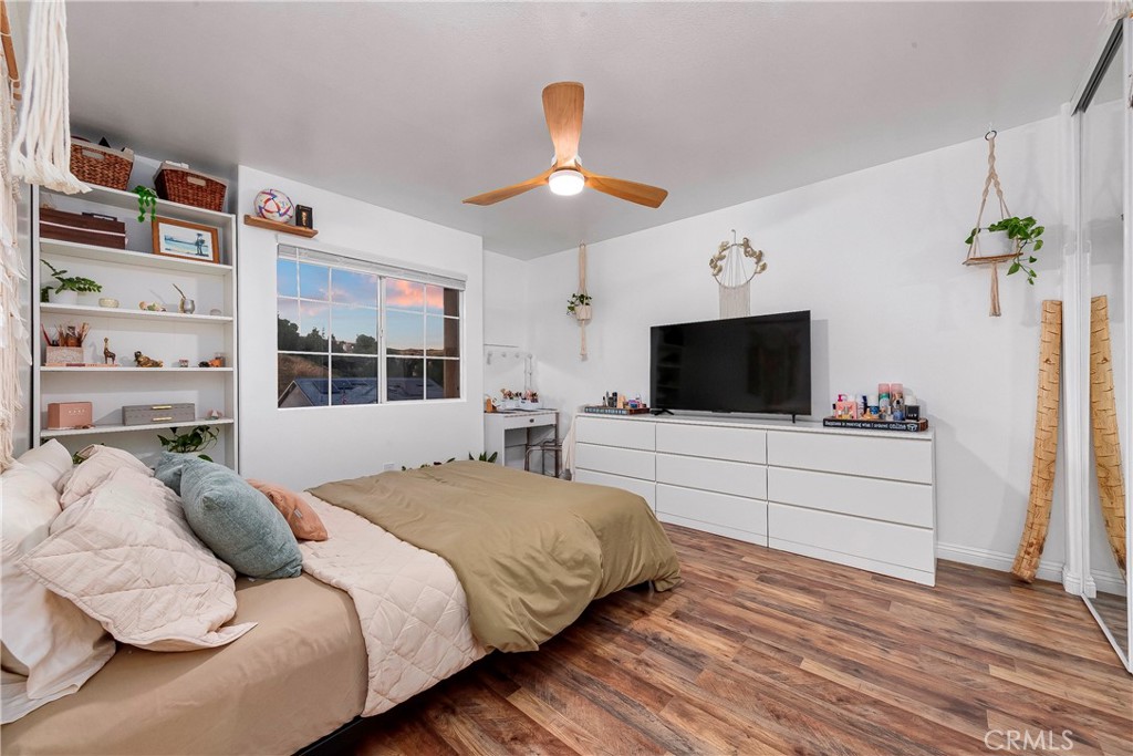 28630 Oak Valley Road Castaic, CA 91384 - Photo 28 of 54 a bedroom with a bed and a flat screen tv
