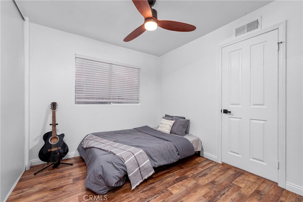 28630 Oak Valley Road Castaic, CA 91384 - Photo 30 of 54 a bedroom with a bed and a chandelier