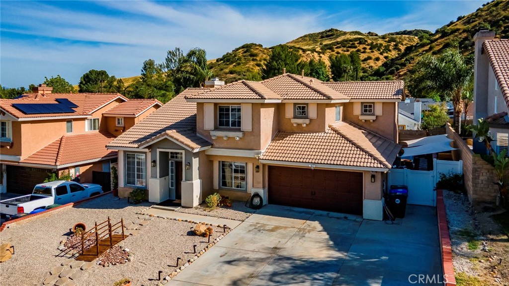 28630 Oak Valley Road Castaic, CA 91384 - Photo 3 of 54 a front view of a house with a yard