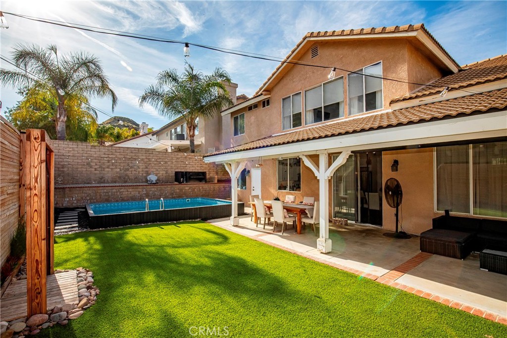 28630 Oak Valley Road Castaic, CA 91384 - Photo 32 of 54 a view of a house with a swimming pool