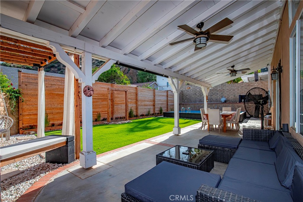 28630 Oak Valley Road Castaic, CA 91384 - Photo 36 of 54 a living room with patio furniture and a garden