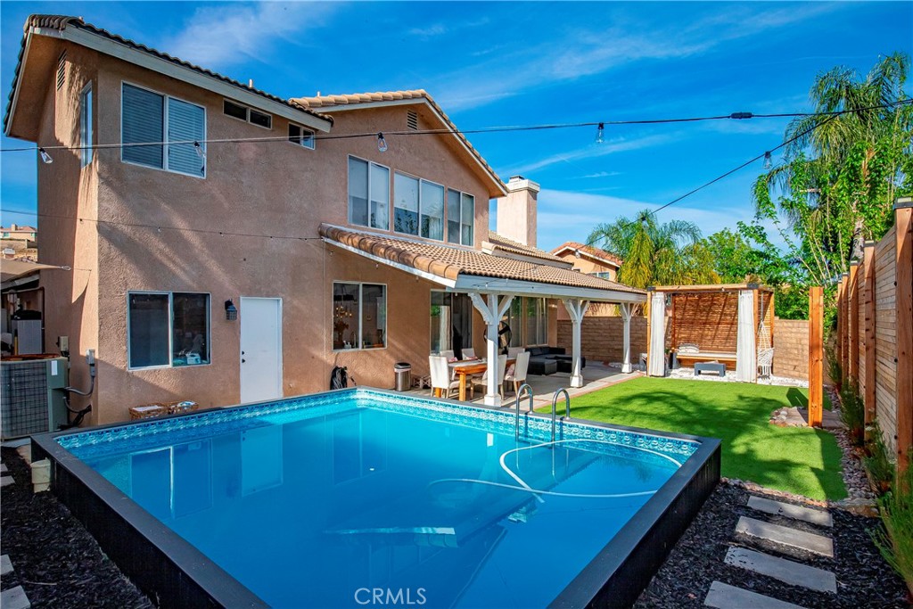 28630 Oak Valley Road Castaic, CA 91384 - Photo 42 of 54 a view of a house with pool and chairs