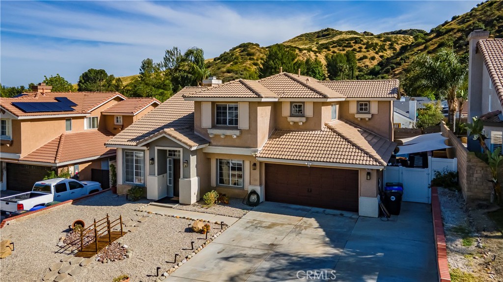 28630 Oak Valley Road Castaic, CA 91384 - Photo 51 of 54 a front view of a house with a yard