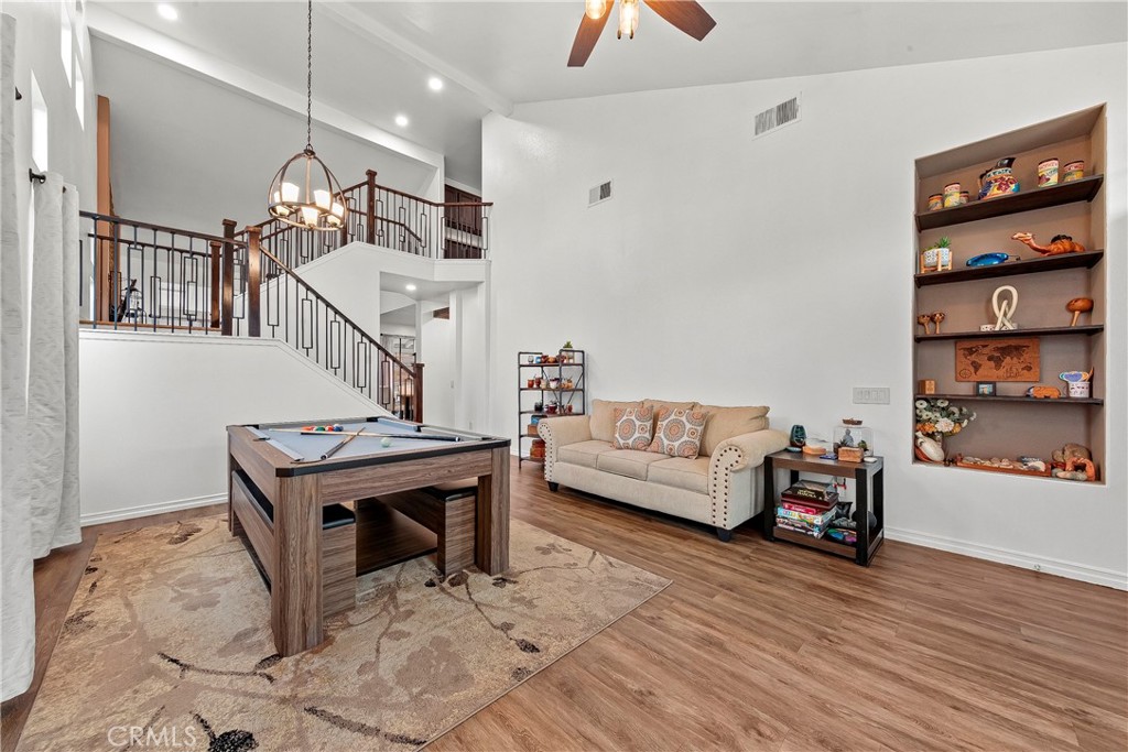 28630 Oak Valley Road Castaic, CA 91384 - Photo 7 of 54 a living room with furniture and a wooden floor