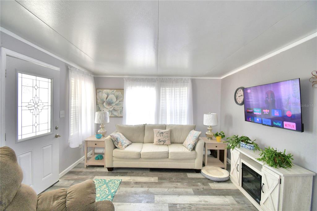 251 Patterson Road, Unit I58 Haines City, FL 33844 - Photo 12 of 52 a living room with furniture and a couch