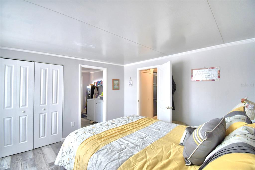 251 Patterson Road, Unit I58 Haines City, FL 33844 - Photo 28 of 52 a bedroom with a bed and a couch