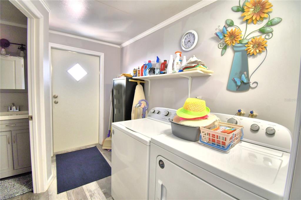 251 Patterson Road, Unit I58 Haines City, FL 33844 - Photo 30 of 52 a bathroom with a sink mirror and vanity