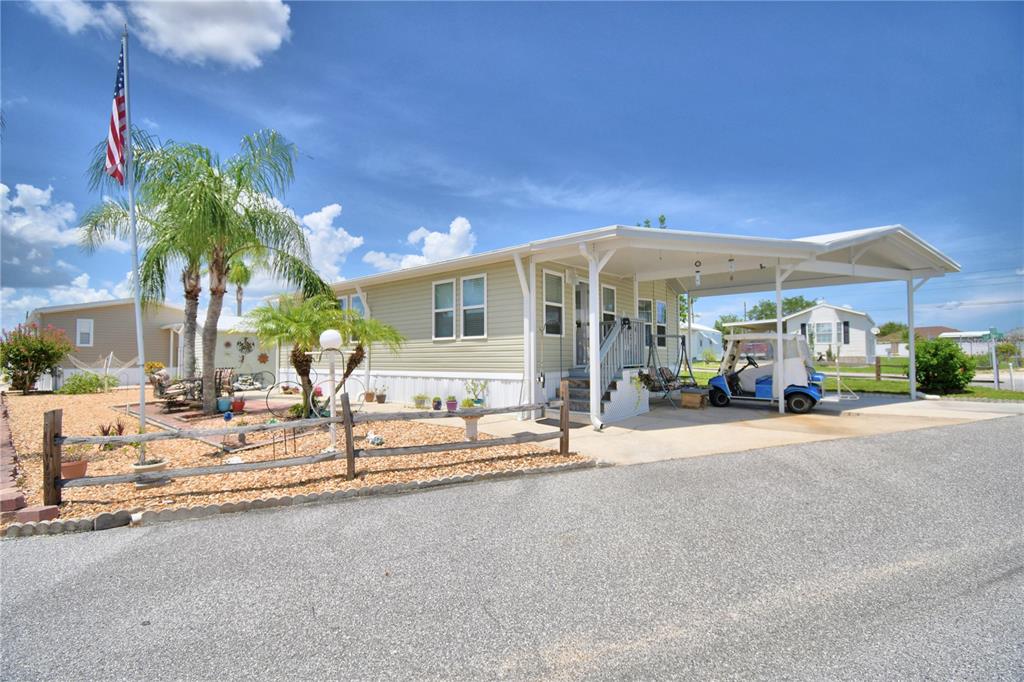 251 Patterson Road, Unit I58 Haines City, FL 33844 - Photo 3 of 52 a view of a house with backyard and sitting area