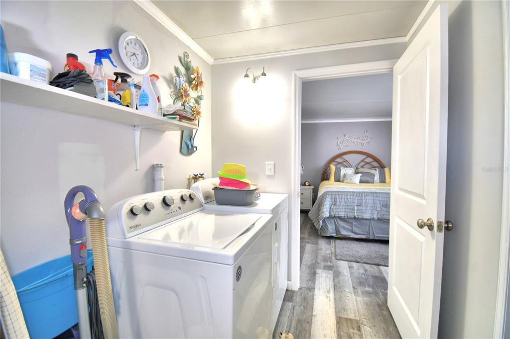 251 Patterson Road, Unit I58 Haines City, FL 33844 - Photo 31 of 52 a utility room with sink dryer and washer