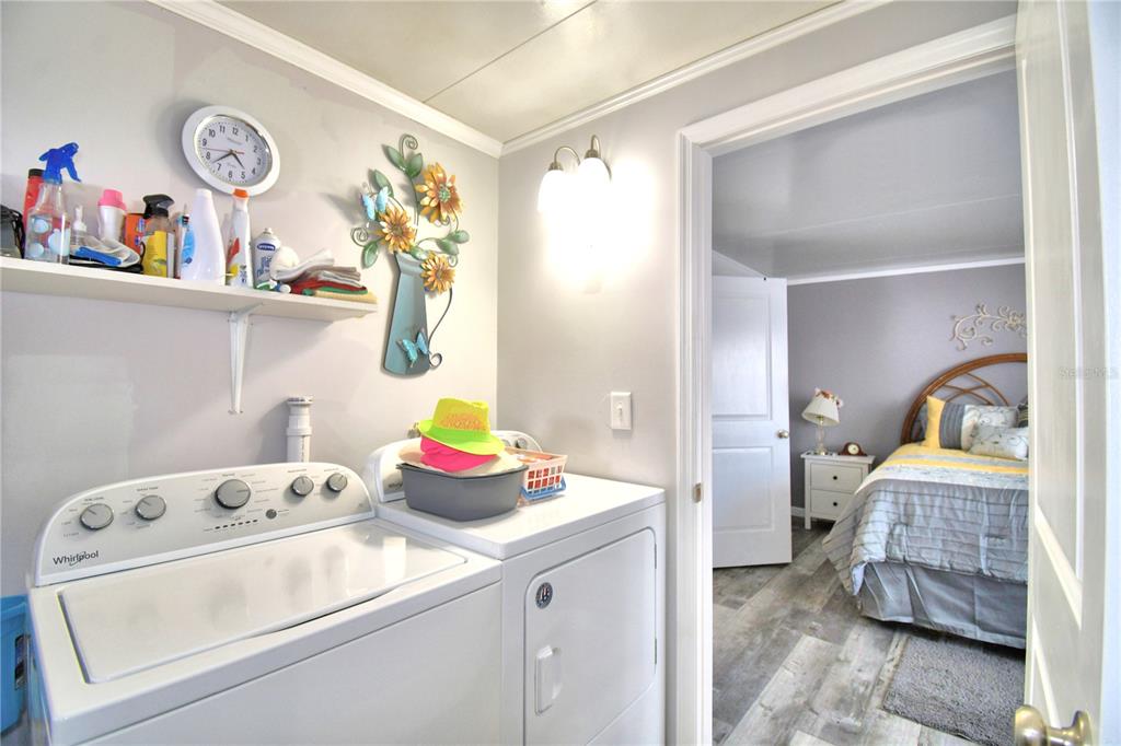 251 Patterson Road, Unit I58 Haines City, FL 33844 - Photo 32 of 52 a bedroom with a bed and cabinets