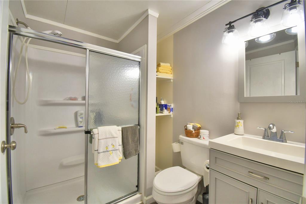 251 Patterson Road, Unit I58 Haines City, FL 33844 - Photo 33 of 52 a bathroom with a sink a toilet and shower