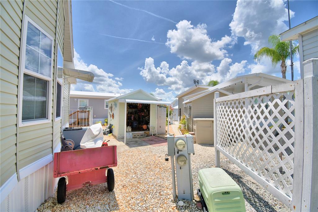 251 Patterson Road, Unit I58 Haines City, FL 33844 - Photo 38 of 52 a view of a dining room with furniture a chandelier and wooden floor