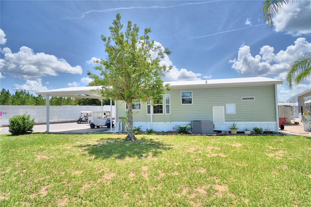 251 Patterson Road, Unit I58 Haines City, FL 33844 - Photo 7 of 52 a view of a house with a yard and sitting area
