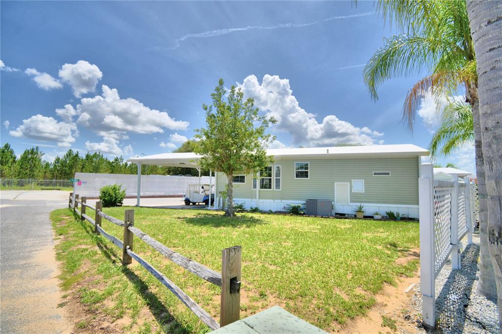 251 Patterson Road, Unit I58 Haines City, FL 33844 - Photo 9 of 52 a view of a house with swimming pool and sitting area