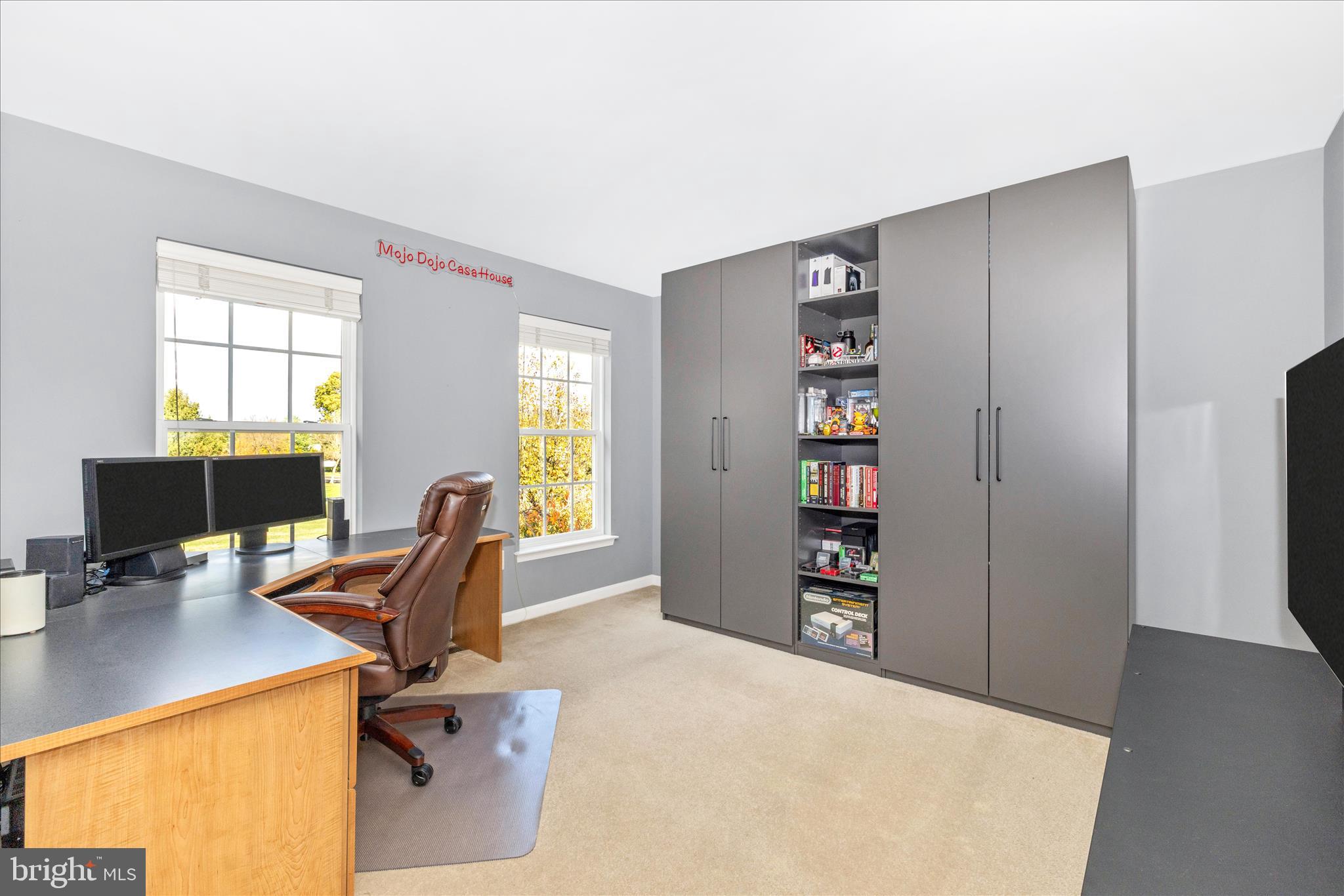 102 Sunlight Drive Frederick, MD 21702 - Photo 32 of 65 a view of a workspace with furniture and a window