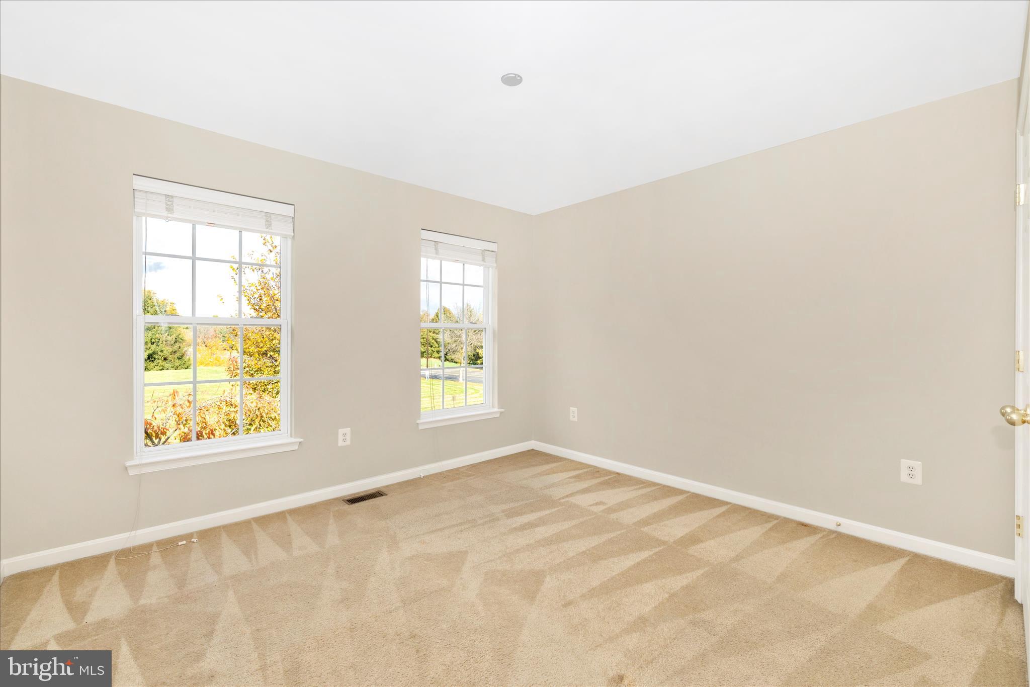 102 Sunlight Drive Frederick, MD 21702 - Photo 37 of 65 an empty room with windows