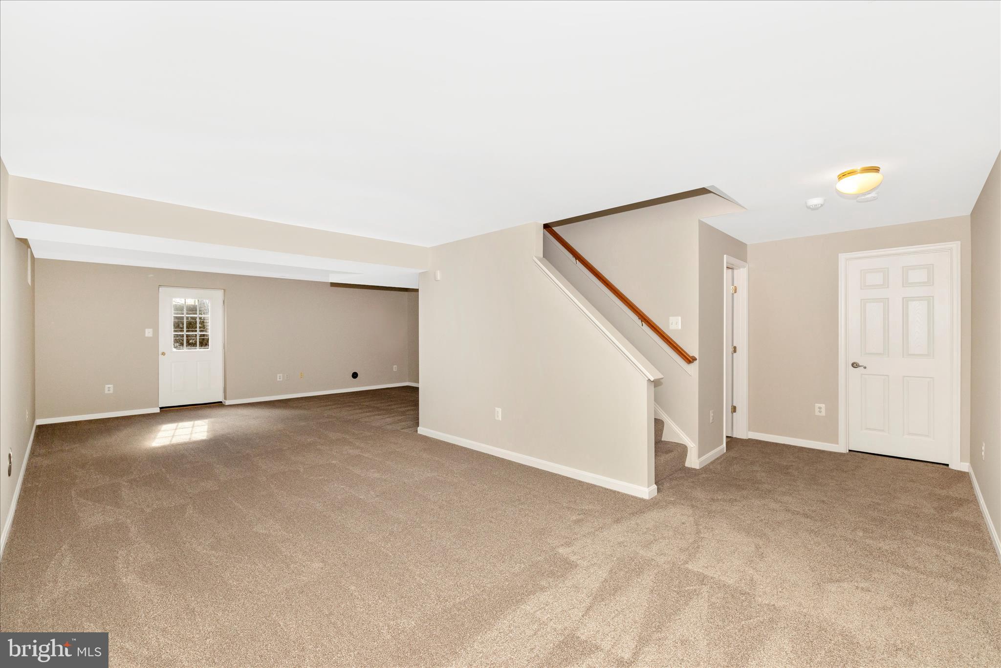 102 Sunlight Drive Frederick, MD 21702 - Photo 45 of 65 a view of an empty room with stairs