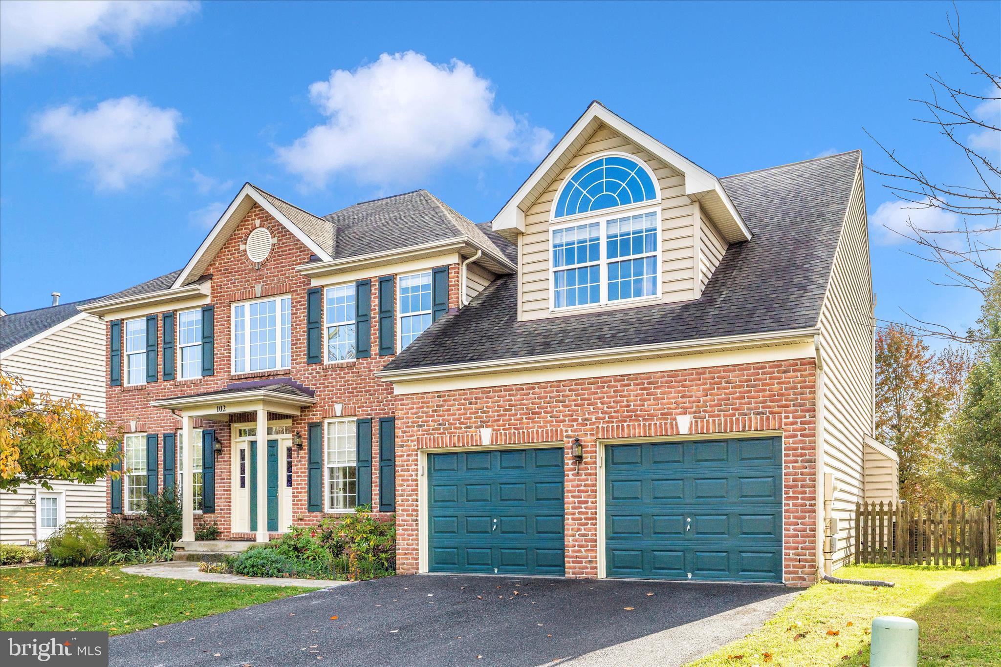 102 Sunlight Drive Frederick, MD 21702 - Photo 51 of 65 a front view of a house with garden