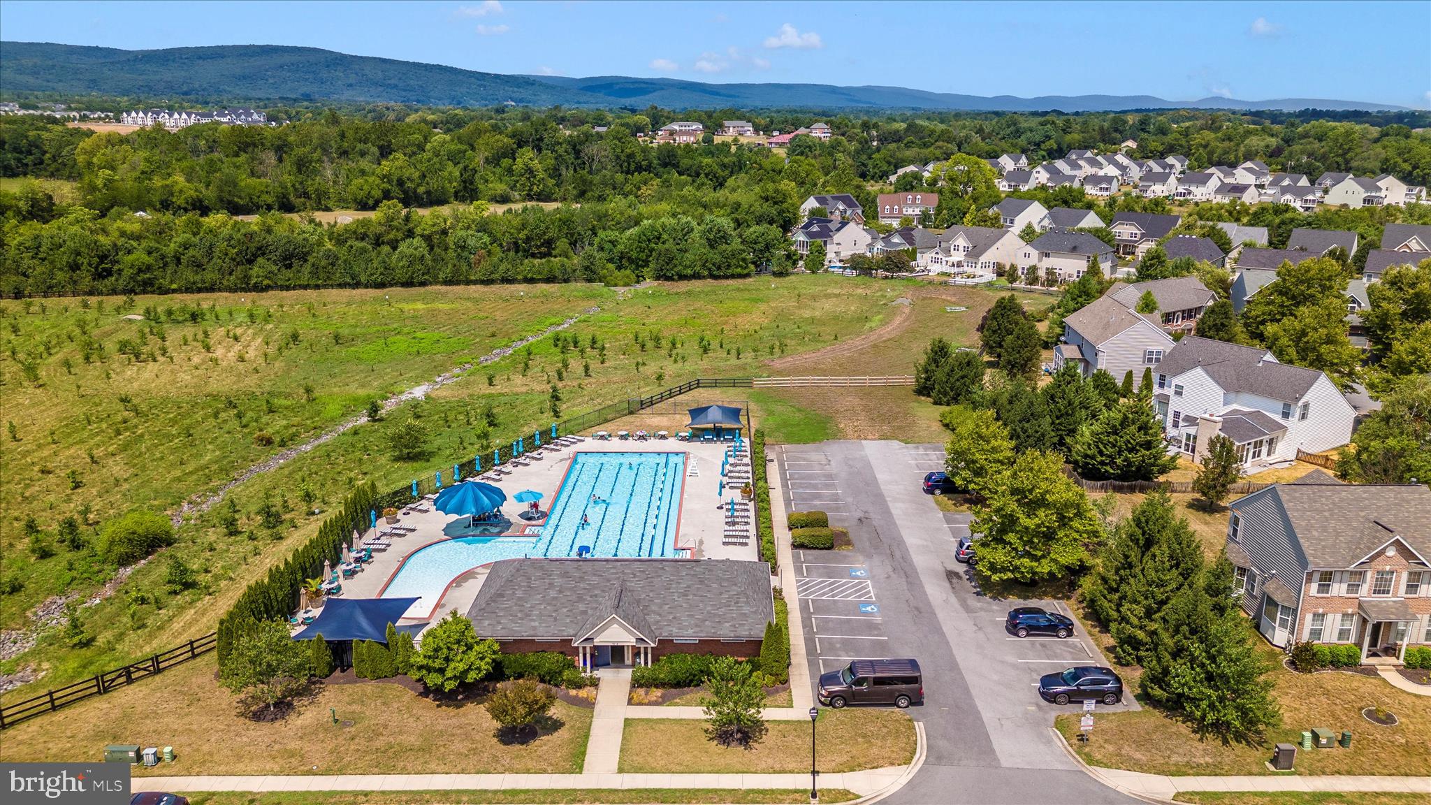 102 Sunlight Drive Frederick, MD 21702 - Photo 63 of 65 an aerial view of residential houses with outdoor space and swimming pool