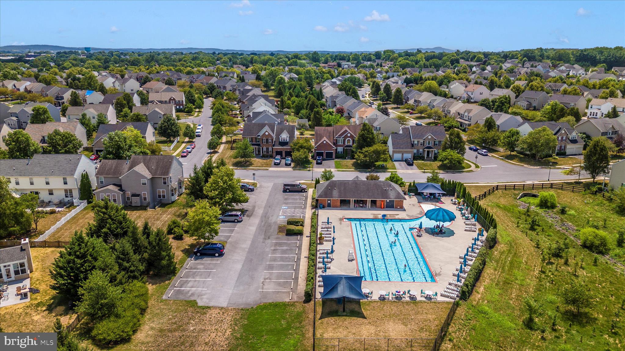 102 Sunlight Drive Frederick, MD 21702 - Photo 64 of 65 an aerial view of residential houses with outdoor space and swimming pool