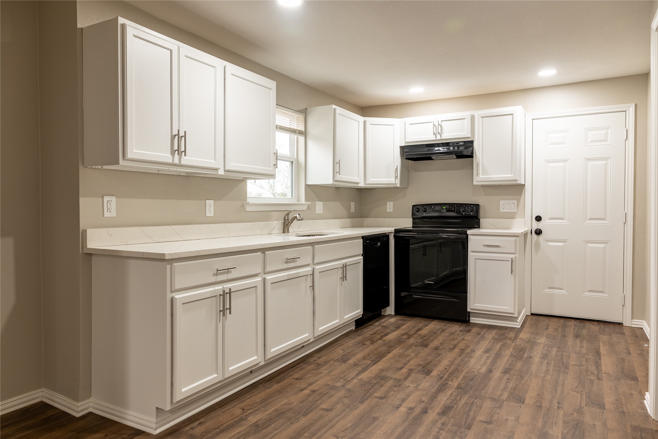 729 Planters Street Emory, TX 75440 - Photo 5 of 22 a kitchen with stainless steel appliances granite countertop a stove a sink and a refrigerator